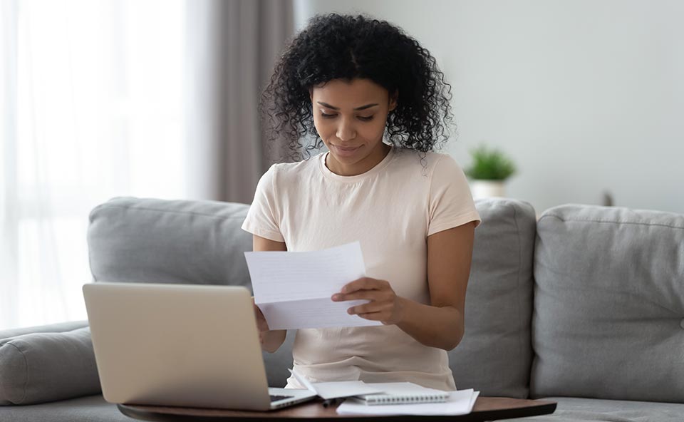 woman receives a letter in the post