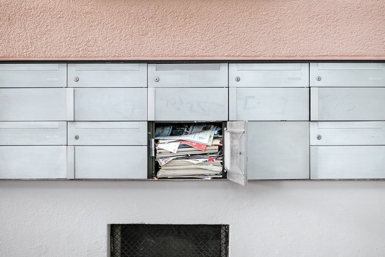 letterbox stuffed with mail